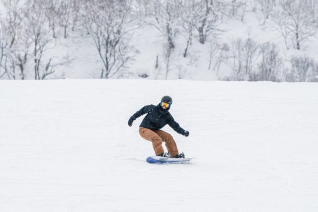 Ella riding Capita Navigator Snowboard in Grand Hirafu